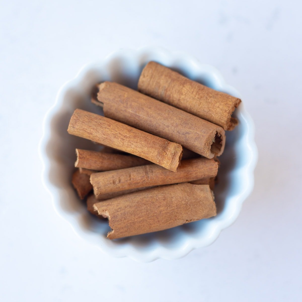 Cinnamon in a small white bowl