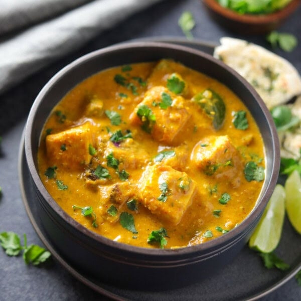 Paneer tikka masala served in a bowl garnished with cilantro