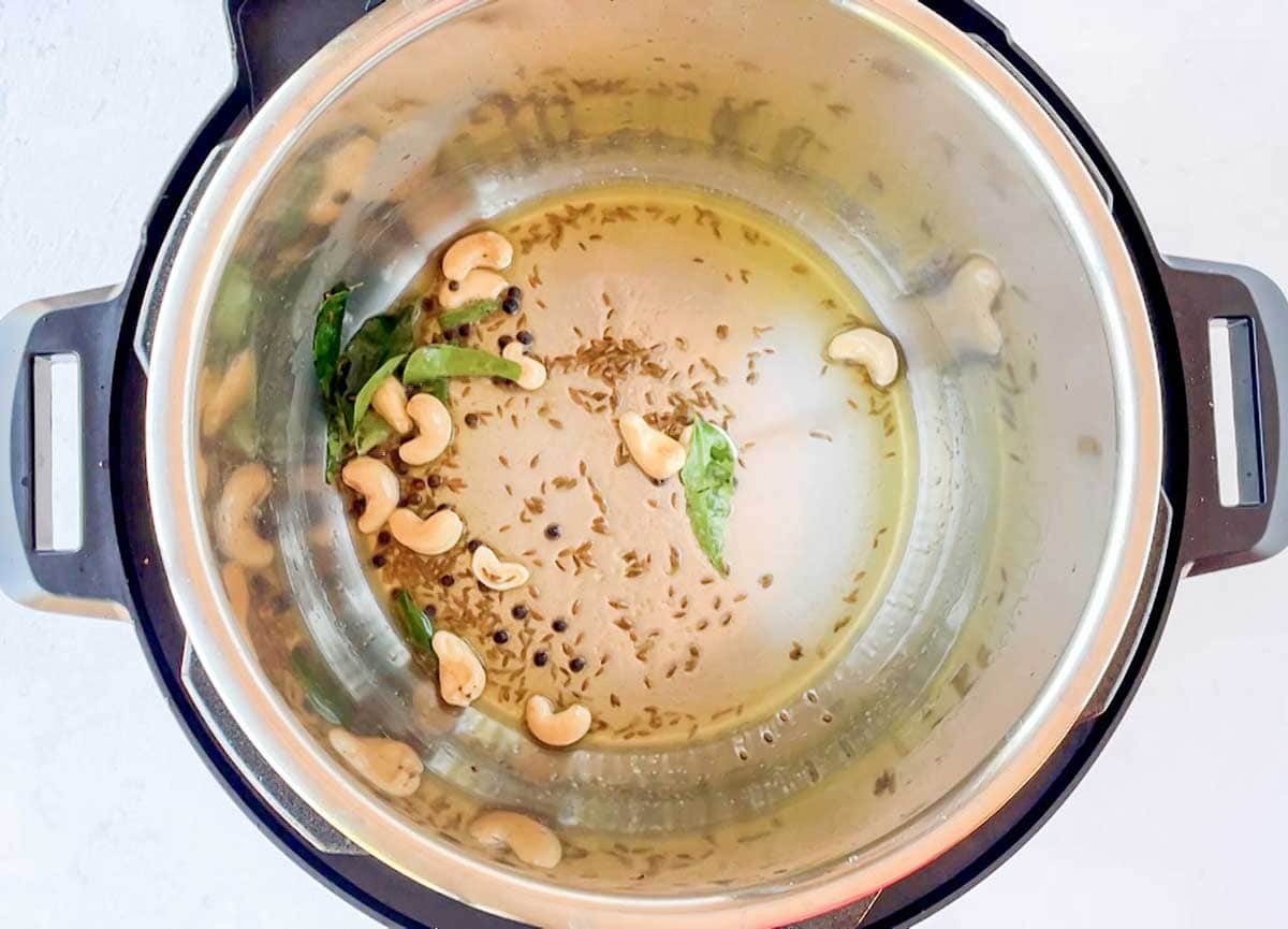 Tempering of cashews, curry leaves and cumin seeds in the instant pot 