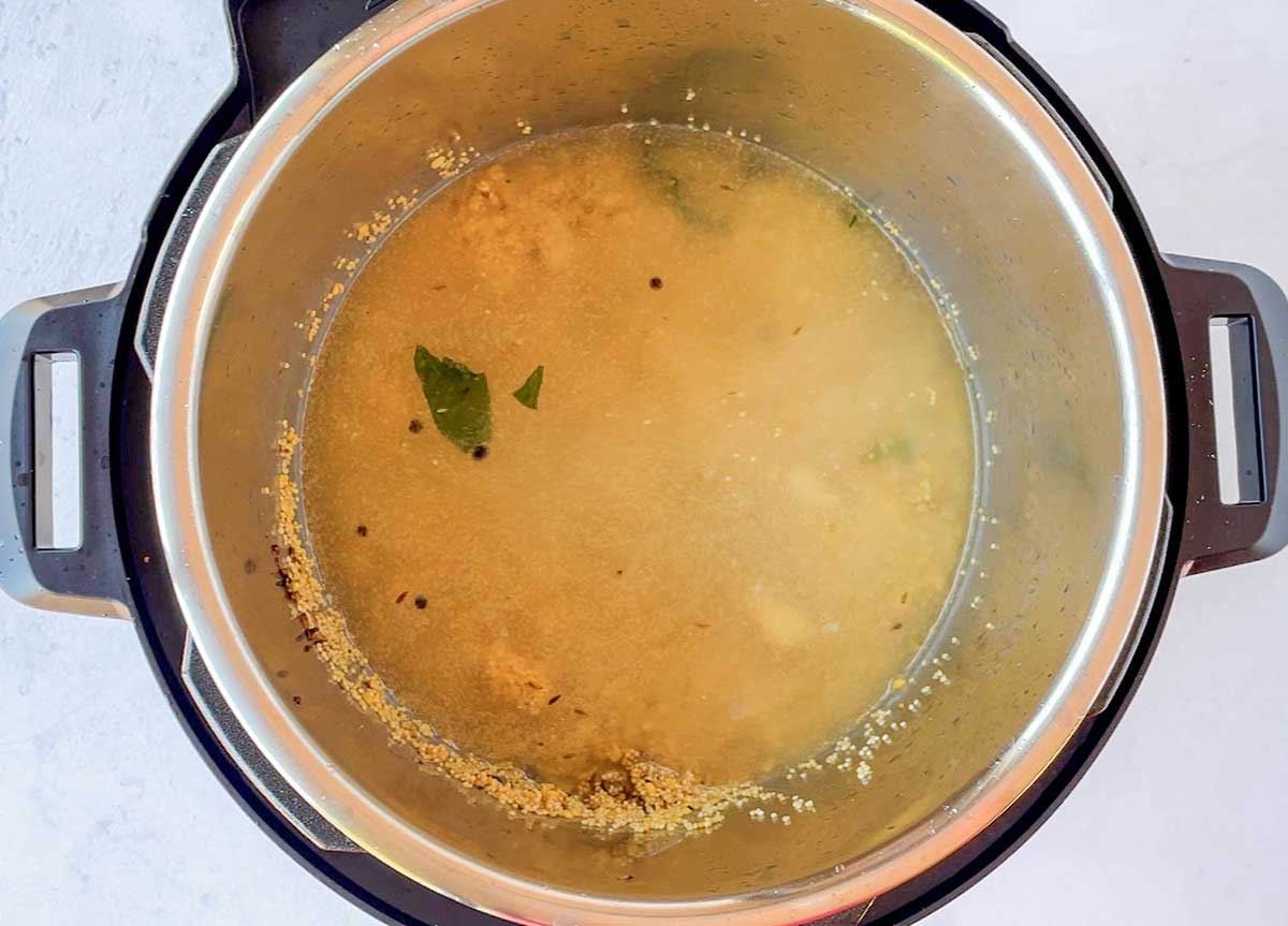 Millet pongal being cooked in instant pot 