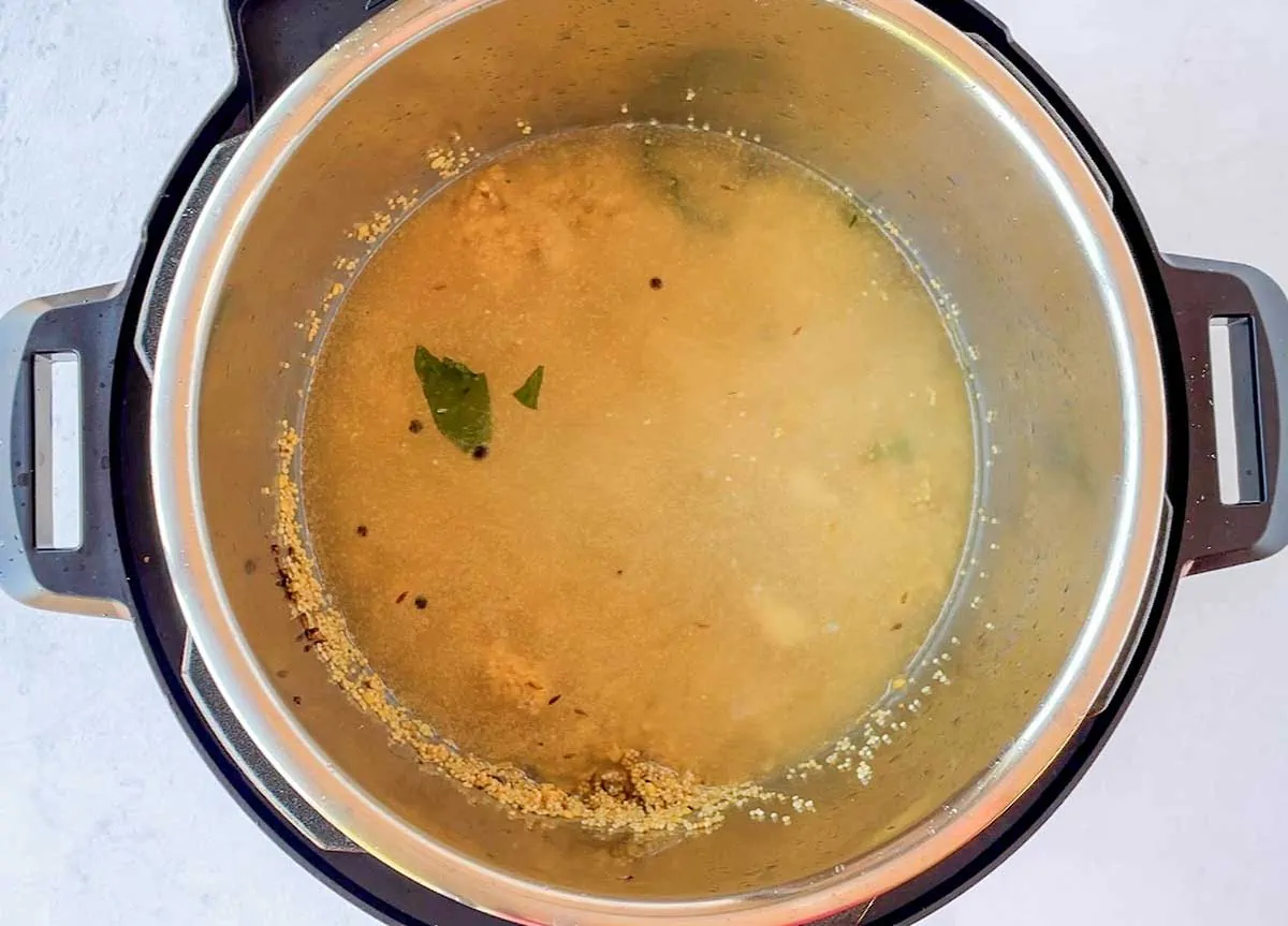 Millet pongal being cooked in instant pot 