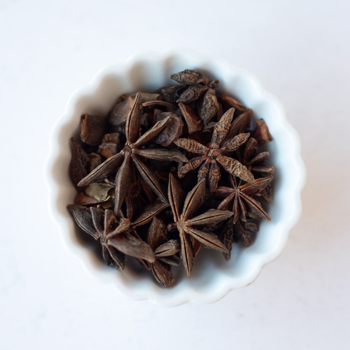 Star anaise in a small white bowl.