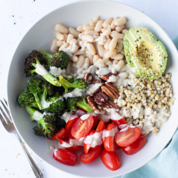 Vegan Sorghum Grain Bowl with broccoli, beans, tomatoes and avocado