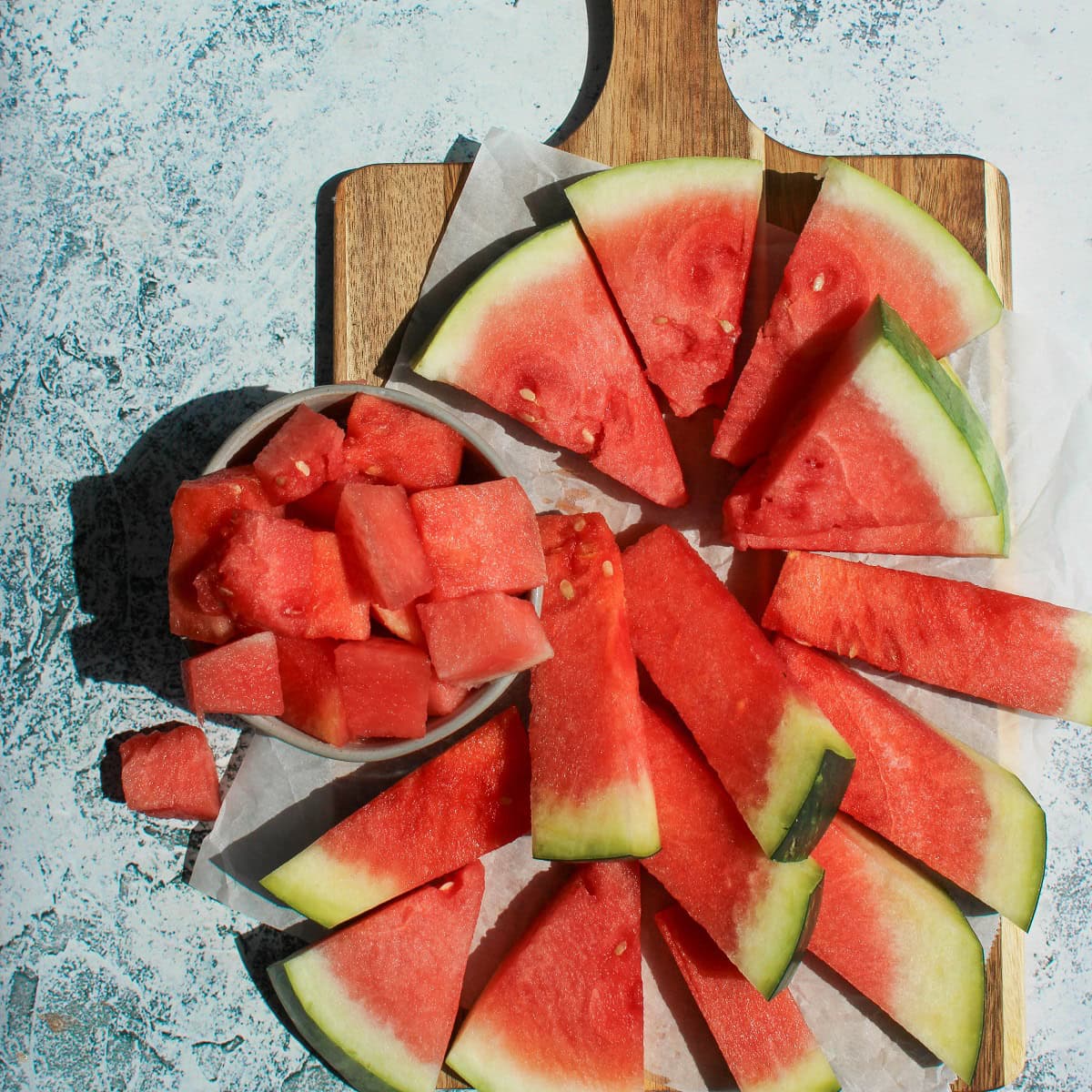 Watermelon pieces on a cutting board