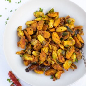 Indian style brussels sprouts stir fry curry with spices in a plate