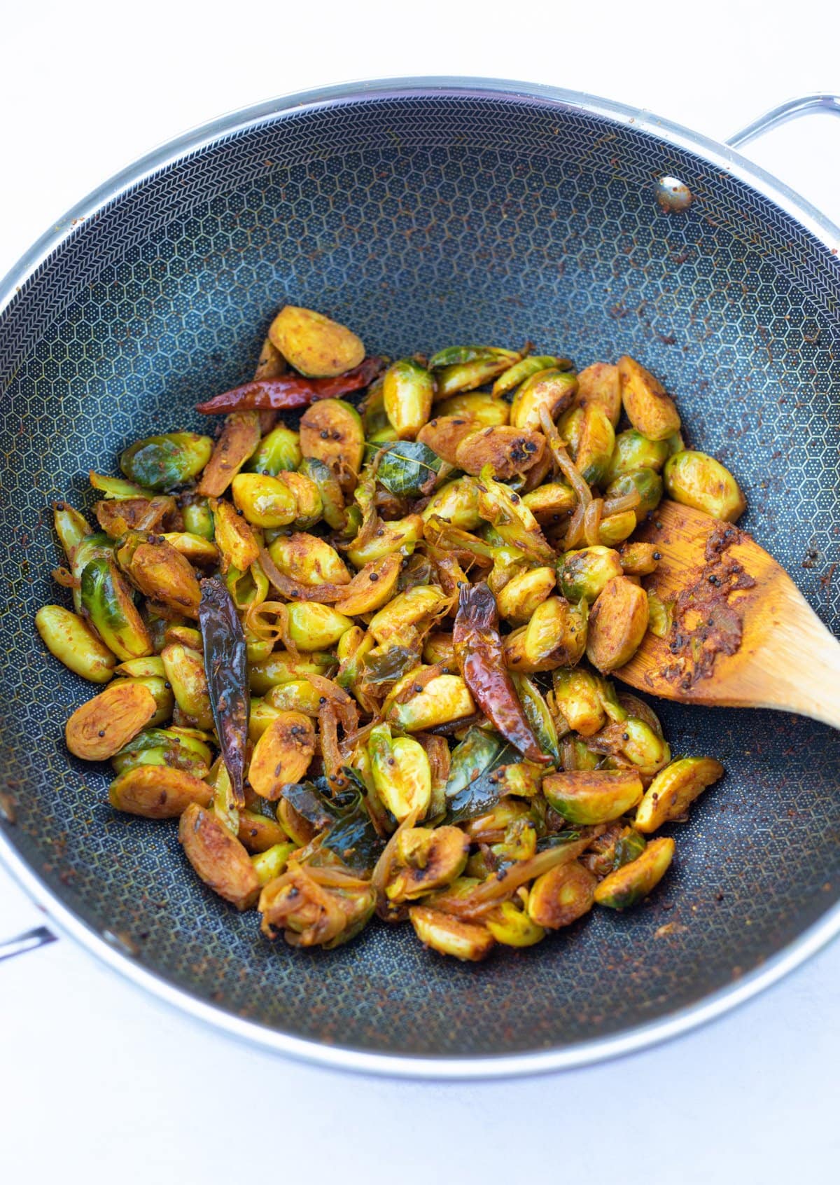 Indian style brussels sprouts cooked in a pan 