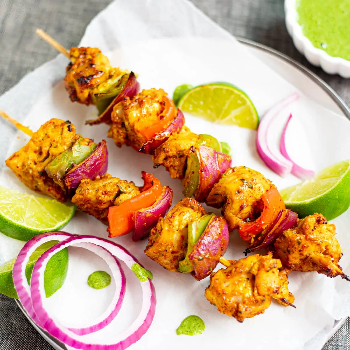 marinated chicken tikka kebab served with chutney, onion and lime wedges 