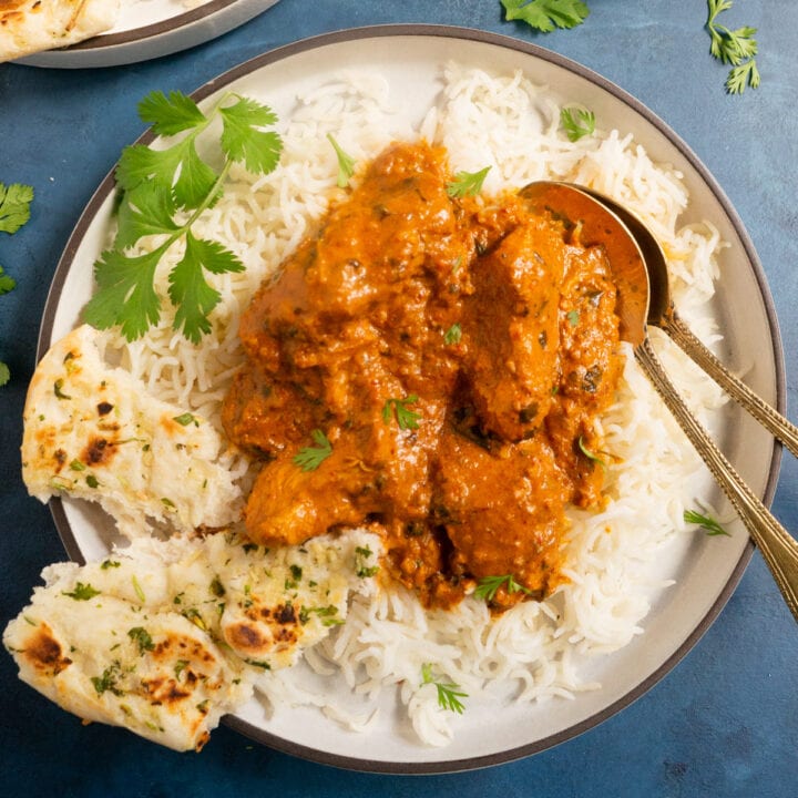 chicken tikka masala in a plate over rice