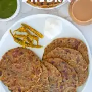 Methi na Dhebra recipe with tea, chutney and pickle on the side