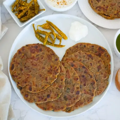Methi Dhebra with tea, chutney and pickle on the side