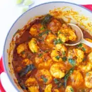 Shrimp Masala/Prawns masala curry in a pan garnished with cilantro leaves
