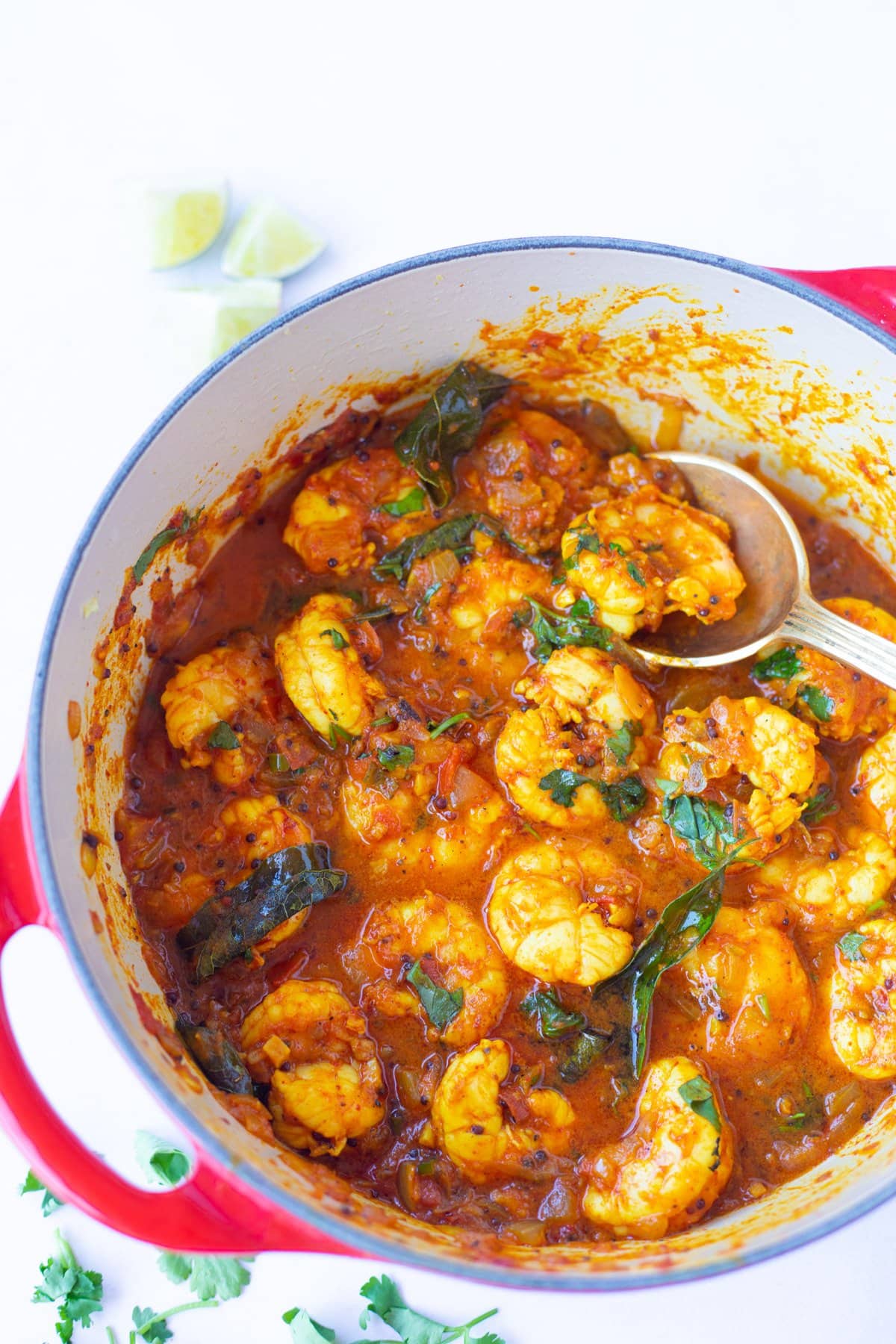 Shrimp Masala/Prawns masala curry in a pan garnished with cilantro leaves
