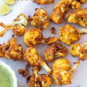 Tandoori Cauliflower on a platter with green chutney