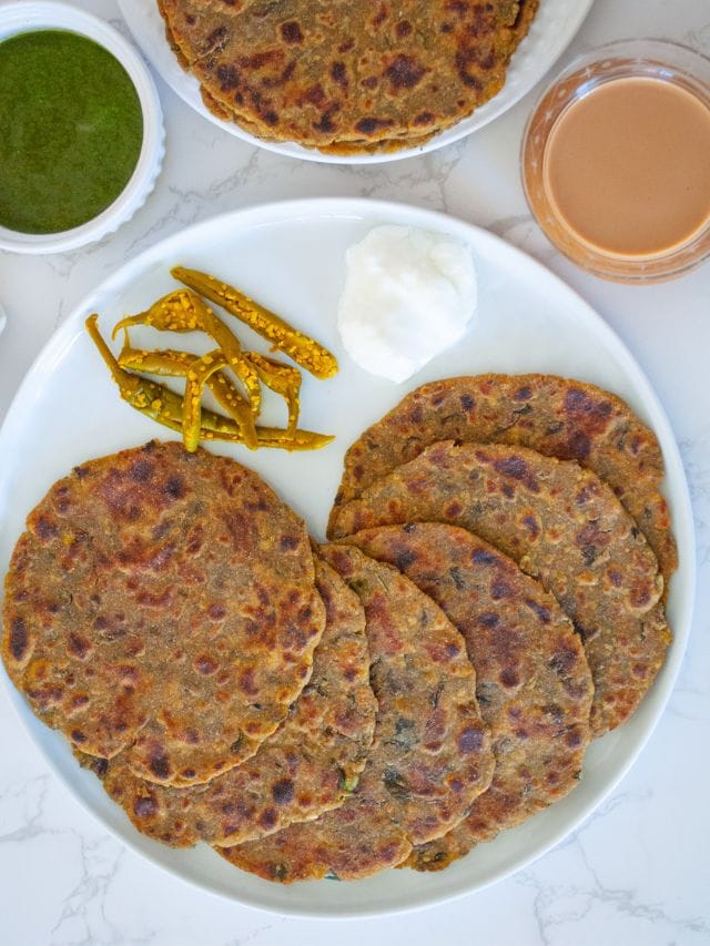 Methi na Debra with tea, chutney and pickle on the side