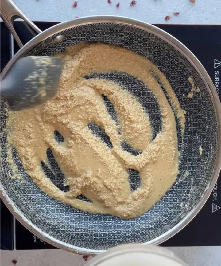roasting almond flour in a pan