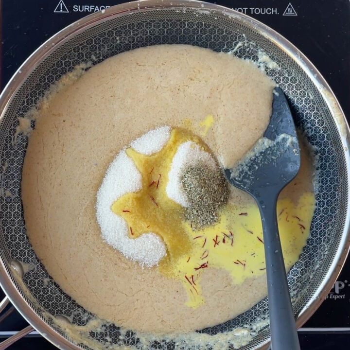 Sugar, saffron milk, Cardamom added to the pan