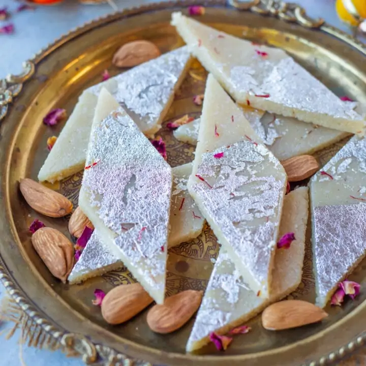 Badam Barfi with almond flour in a plate with almonds