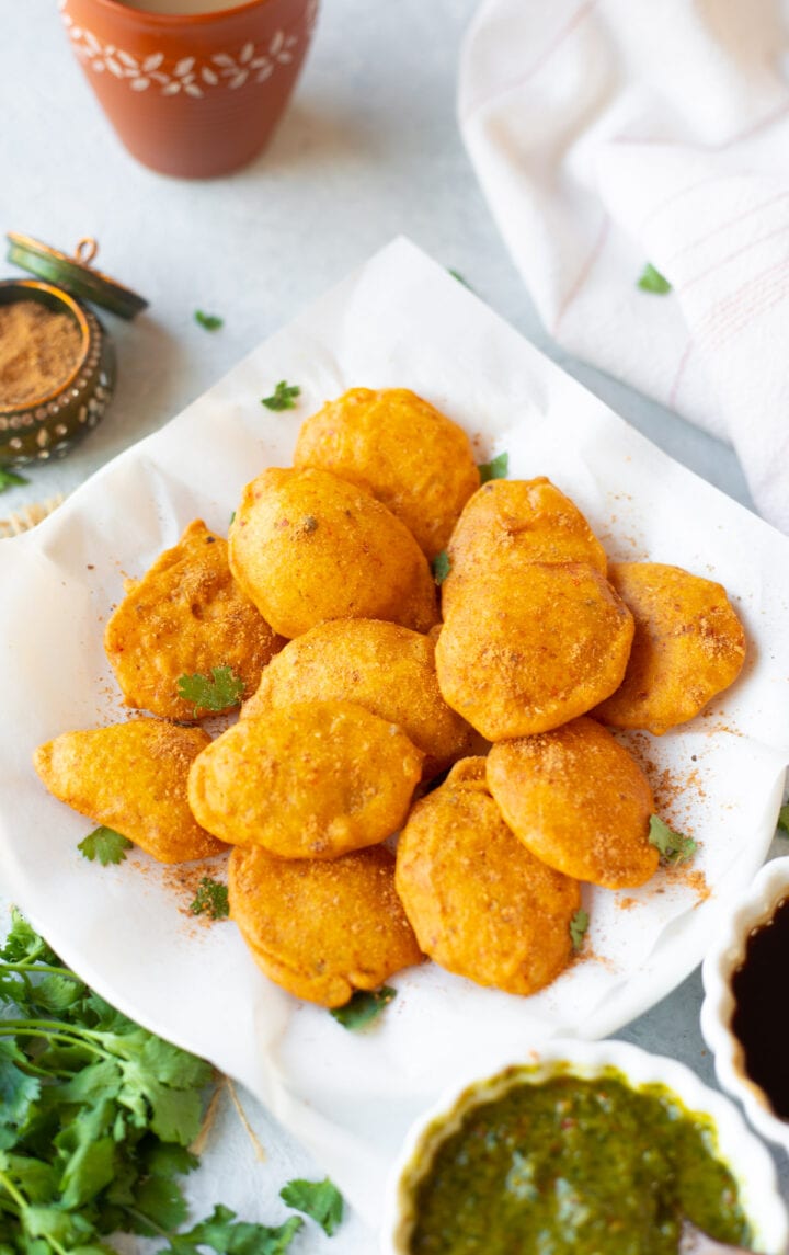 Aloo pakora garnished with cilantro and chaat masala