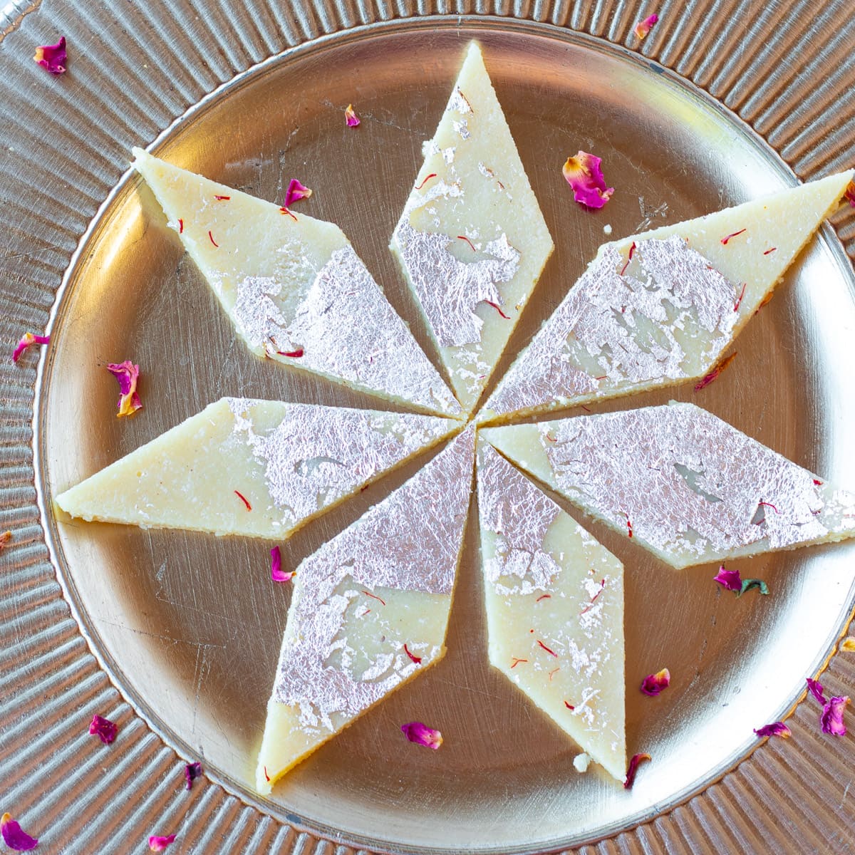 Badam barfi with almond flour with silver leaves on the top