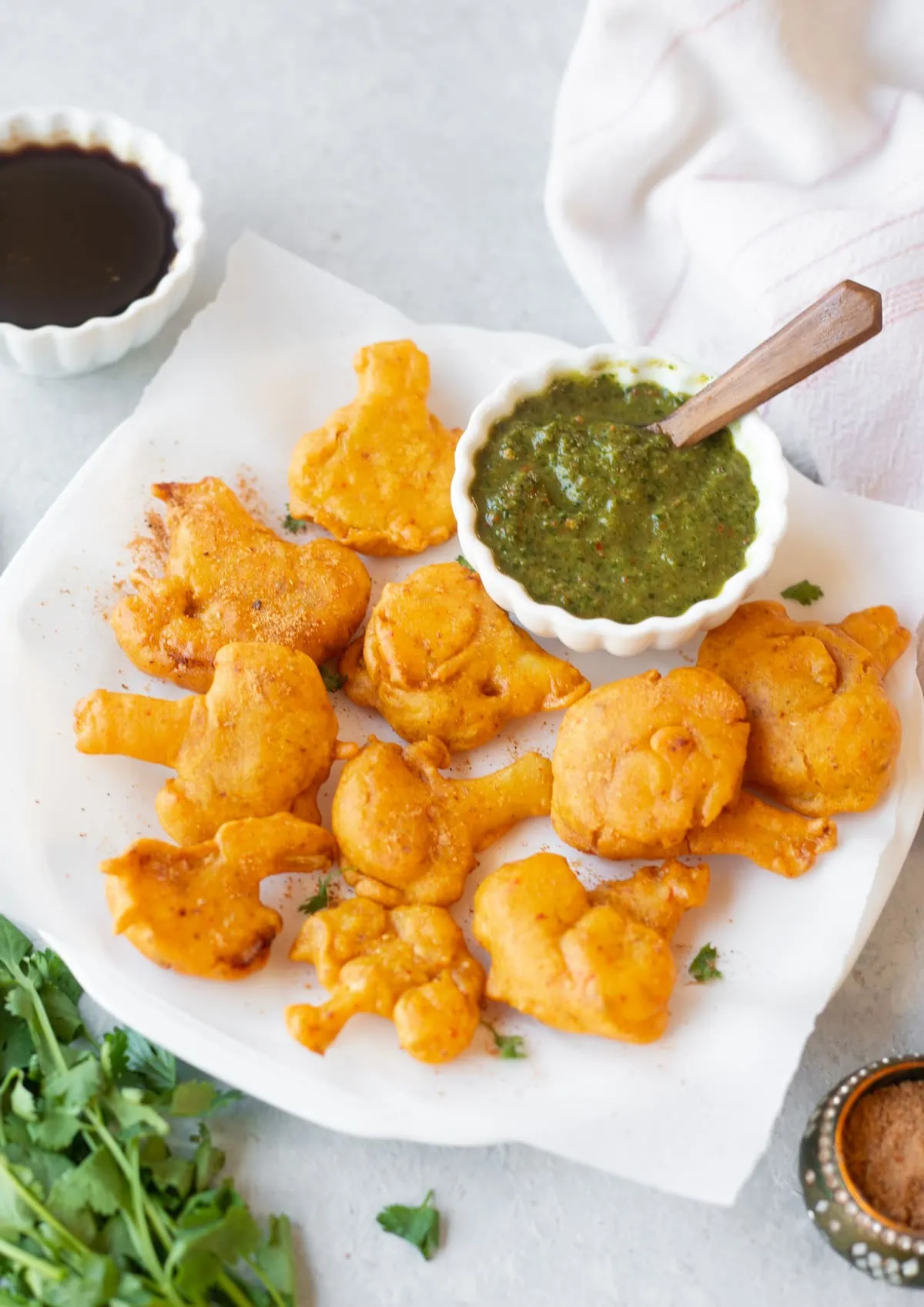 Spicy Cauliflower Pakoras with green and tamarind chutney on the side