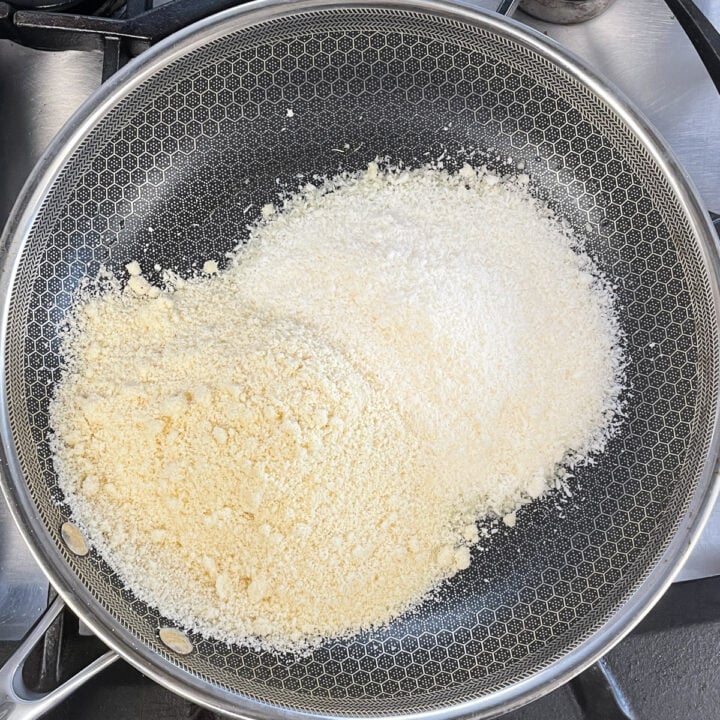 Desiccated coconut and almond flour in a pan to make ladoo