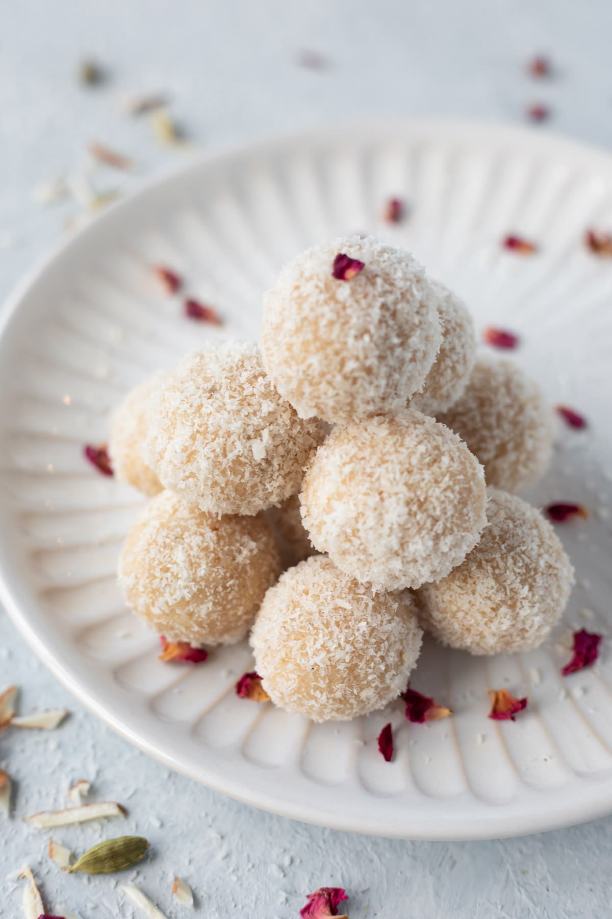 Badam ladoo with coconut in a white plate
