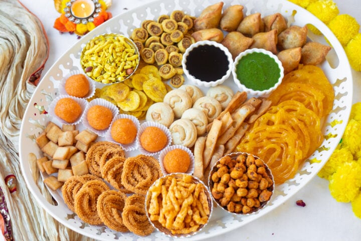 Indian Asian charcuterie board with snacks and sweets