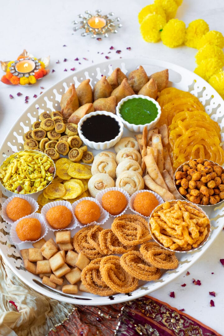 Indian Diwali charcuterie board with a variety of snacks and sweets