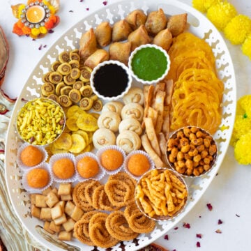 Indian-style desi charcuterie board for Diwali or Ramadan with a variety of snacks and sweets