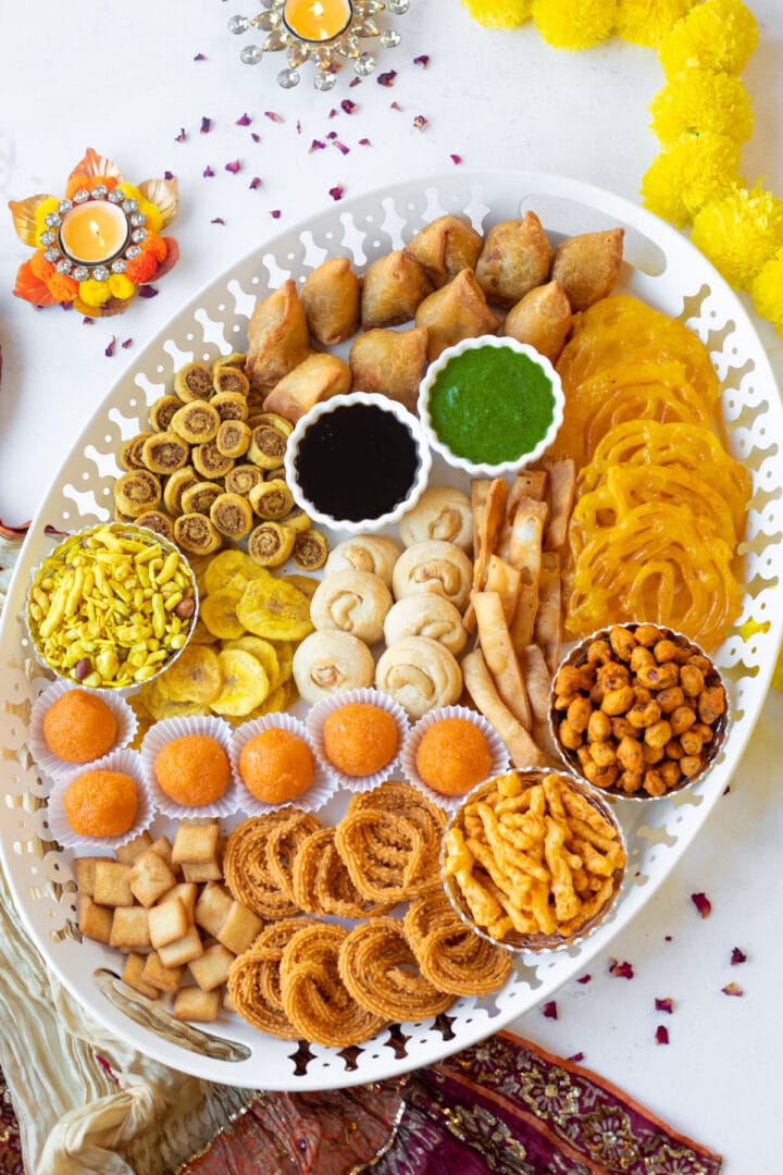 desi charcuterie board for Diwali or Ramadan with a variety of snacks and sweets