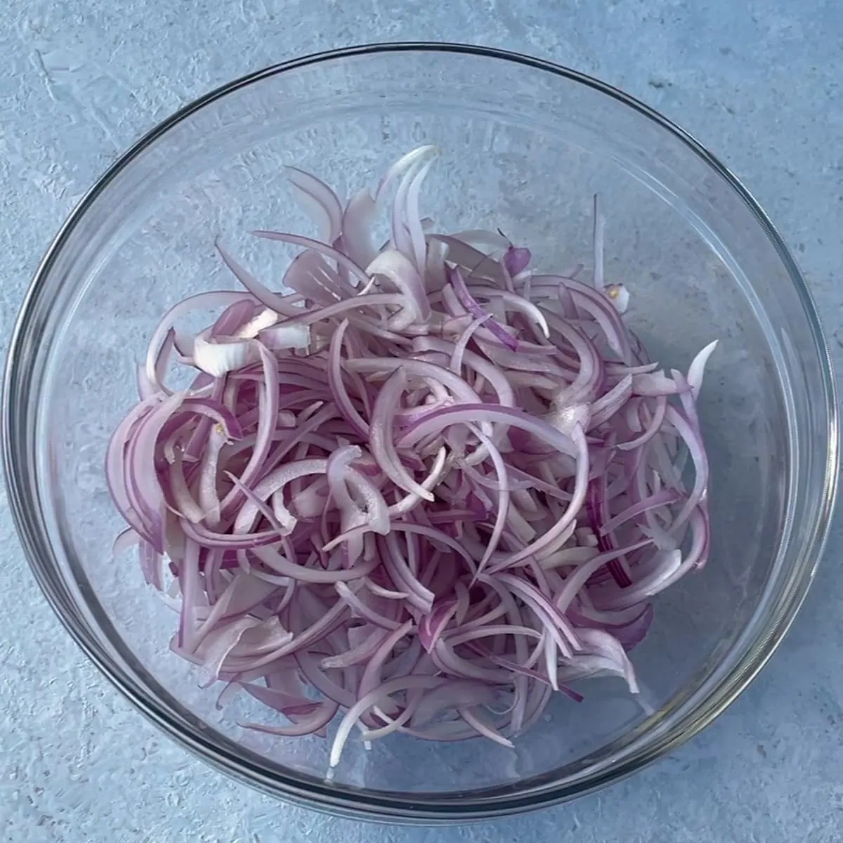 sliced onions in a bowl