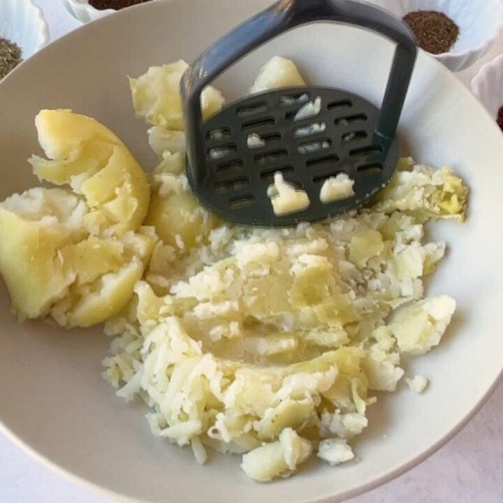 mash the boiled potatoes in a bowl