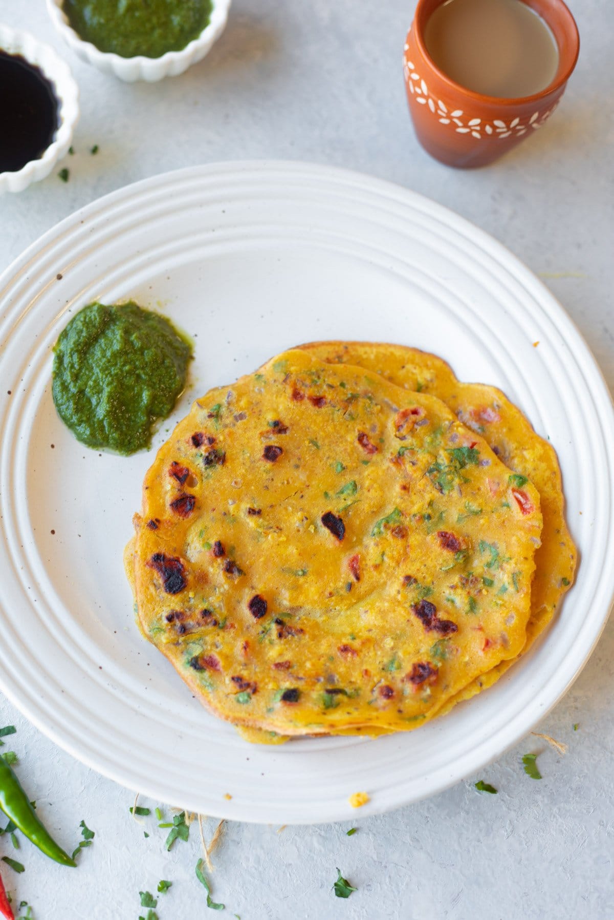 Besan Vegetable Chilla in a plate with chutney