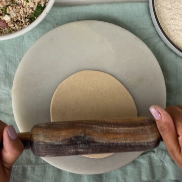 rolling the paratha to add the filling