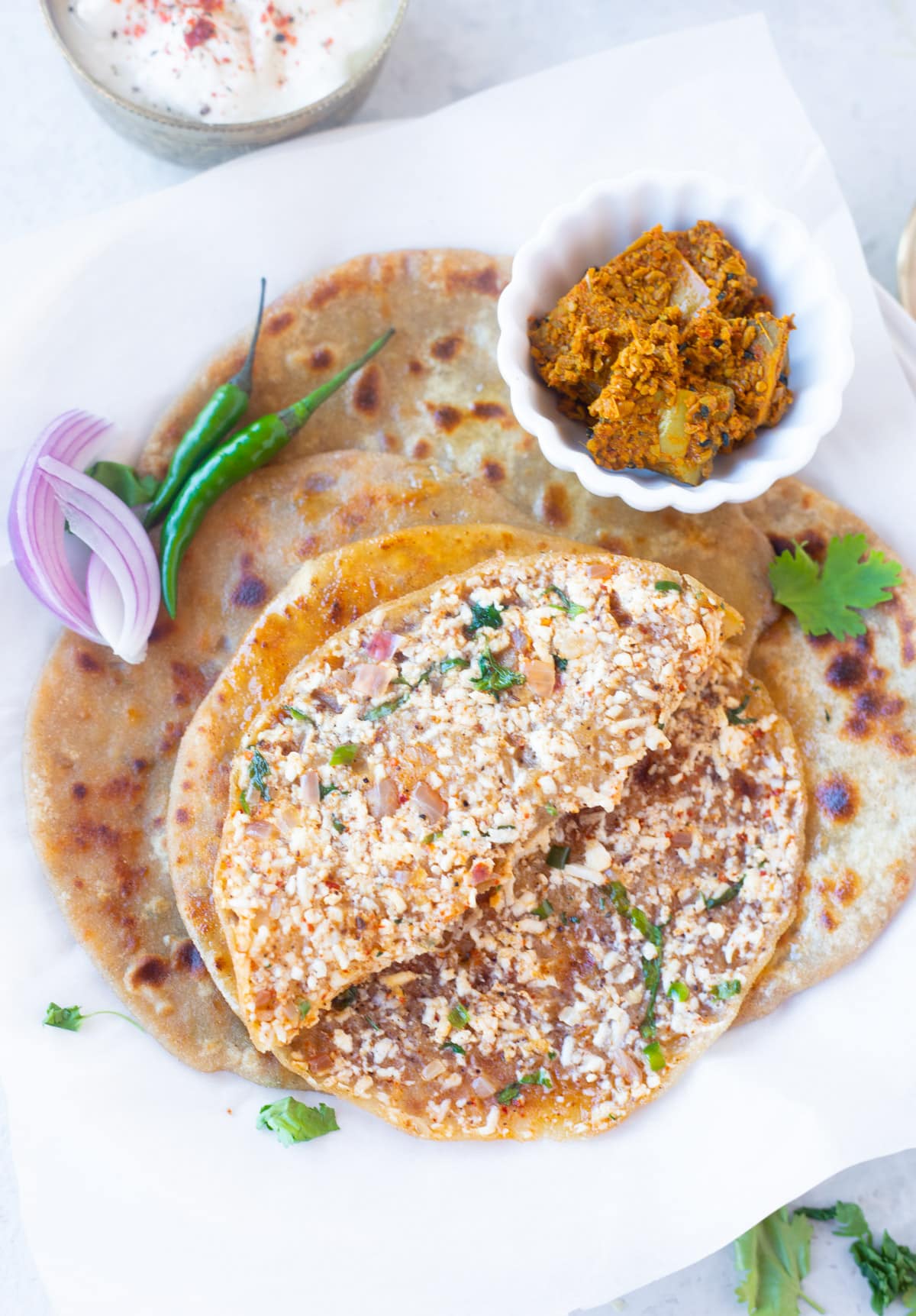 cooked paneer paratha cut from middle to show filling