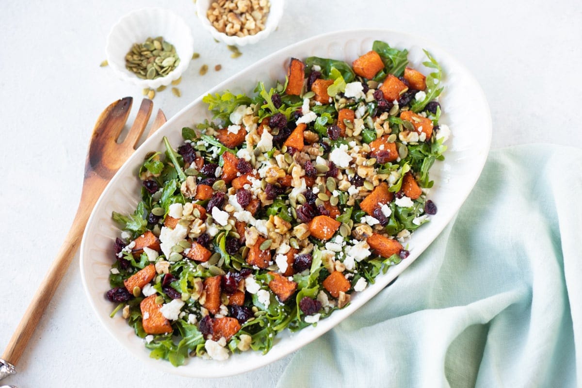 Pumpkin salad with feta and walnuts in a platter