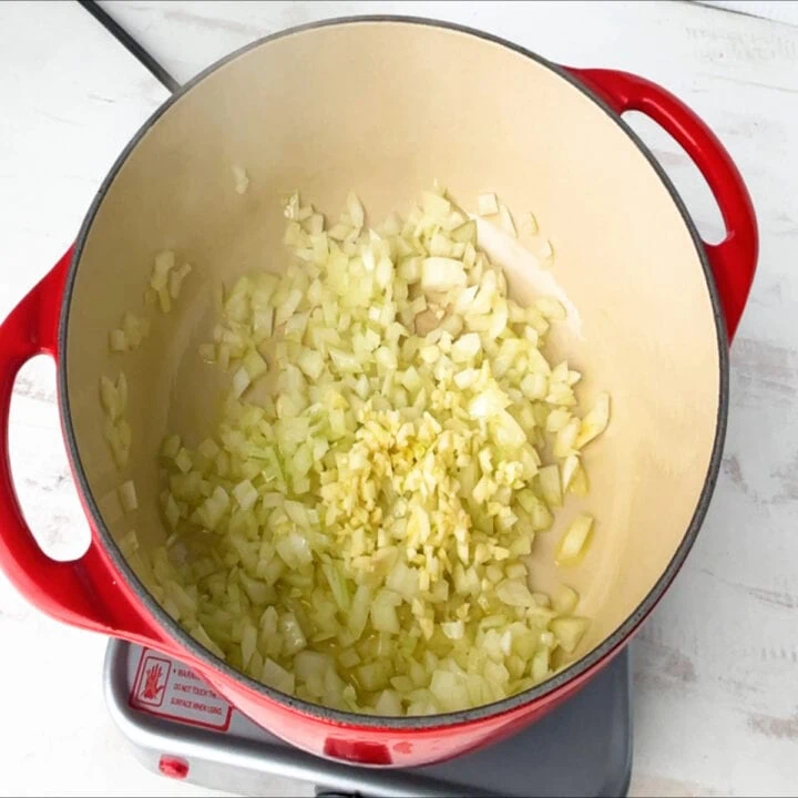 garlic to the pot to make pumpkin soup