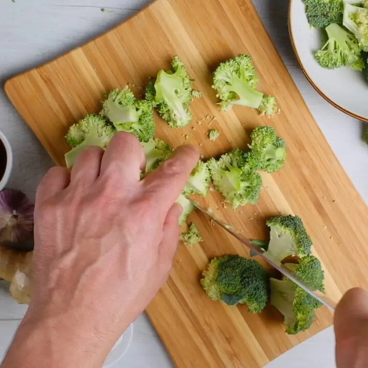 Cut Broccoli florets on a chopping board