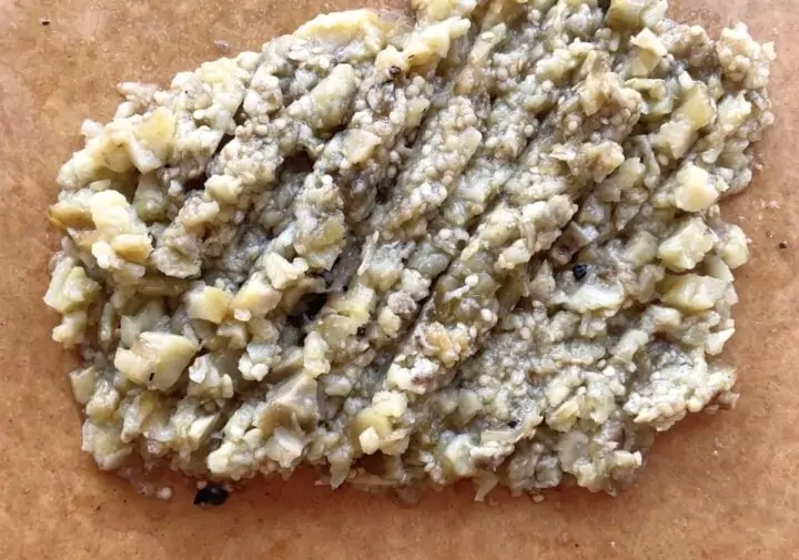 mashed roasted eggplant on a cutting board