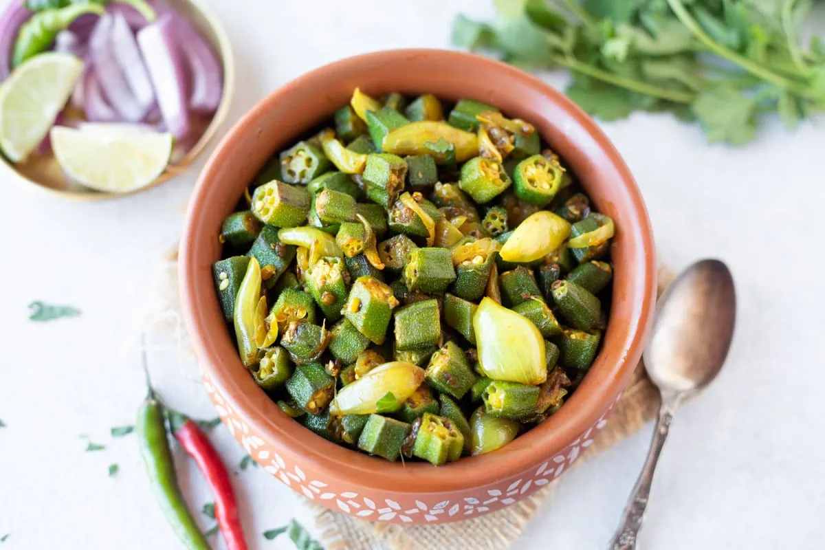 Bhindi do pyaza in earthy pot