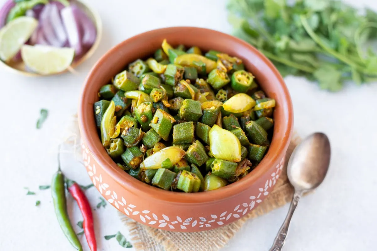 Bhindi do pyaza recipe with red onions on the side