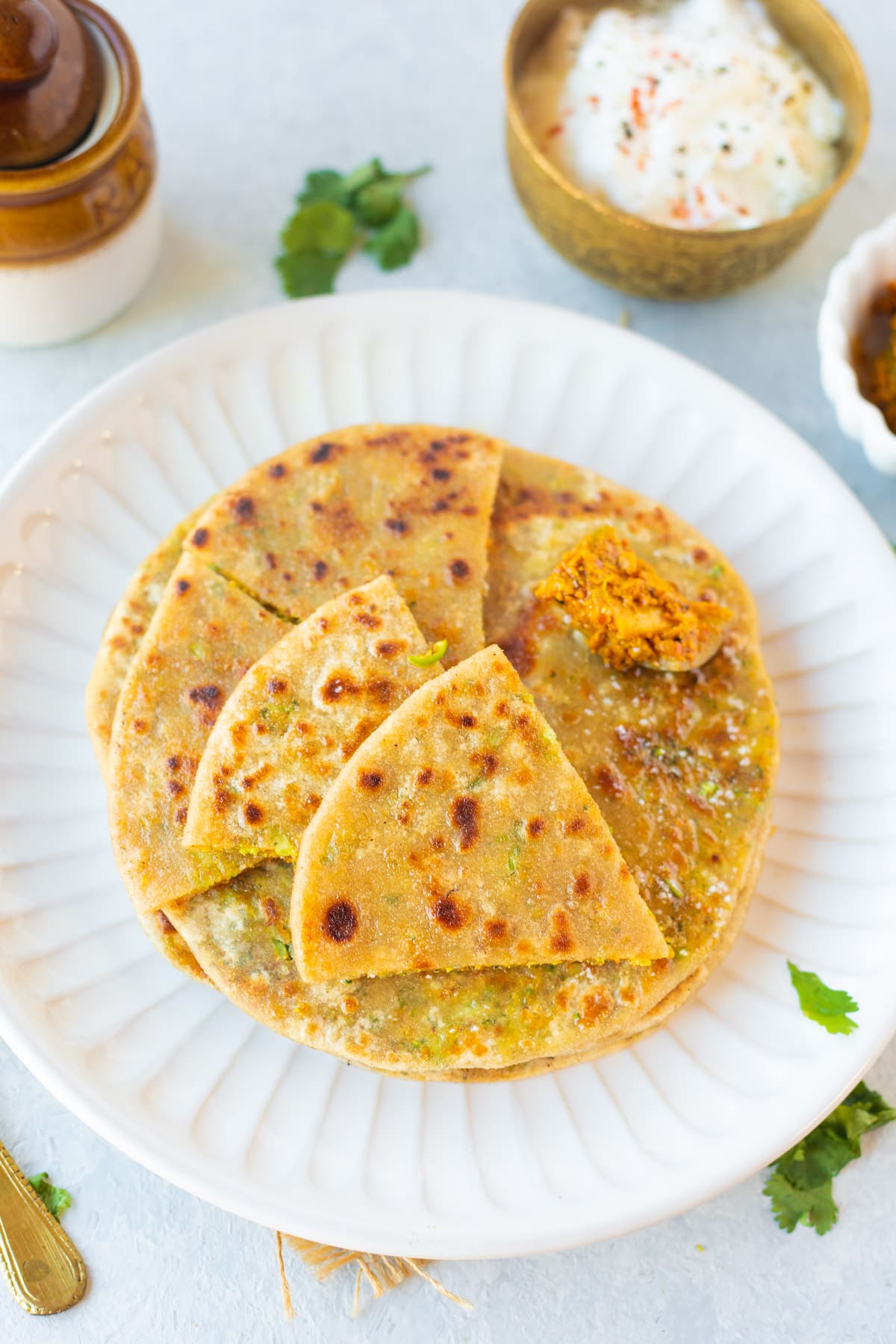 Broccoli paratha into four pieces in a plate