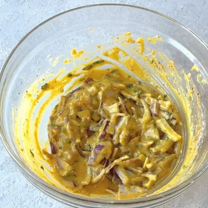 mixture for pakoda in a bowl