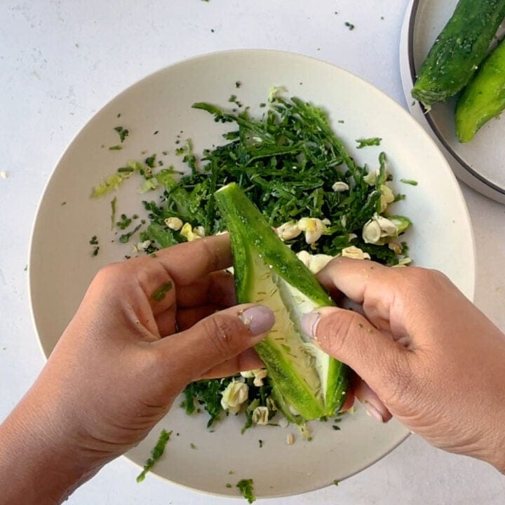 open the slit of karela with hands
