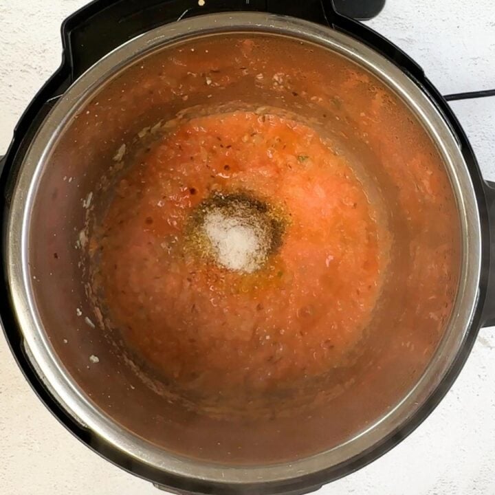 add spices on the onion tomato masala in instant pot