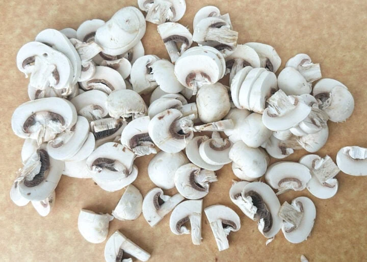 sliced mushrooms on a chopping board