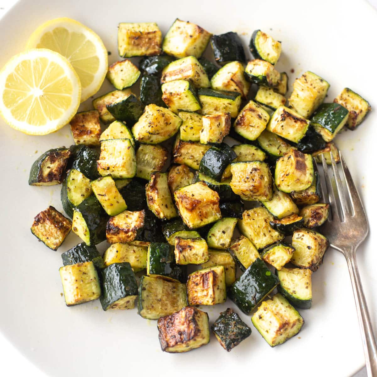 Air Fryer Zucchini with form and lemon pieces