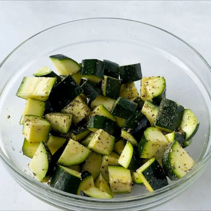 seasoned zucchini in a glass bowl