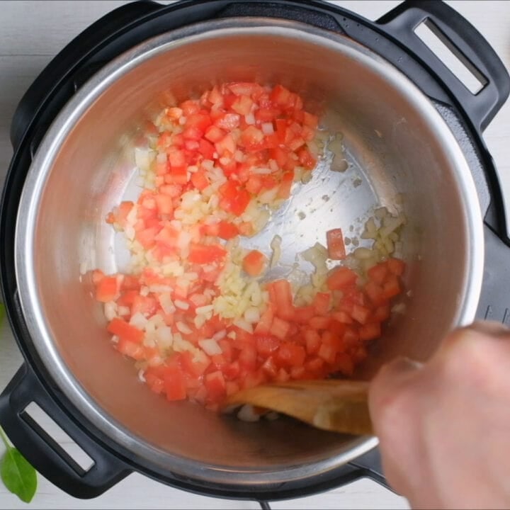 add diced tomato to the instant pot and cook