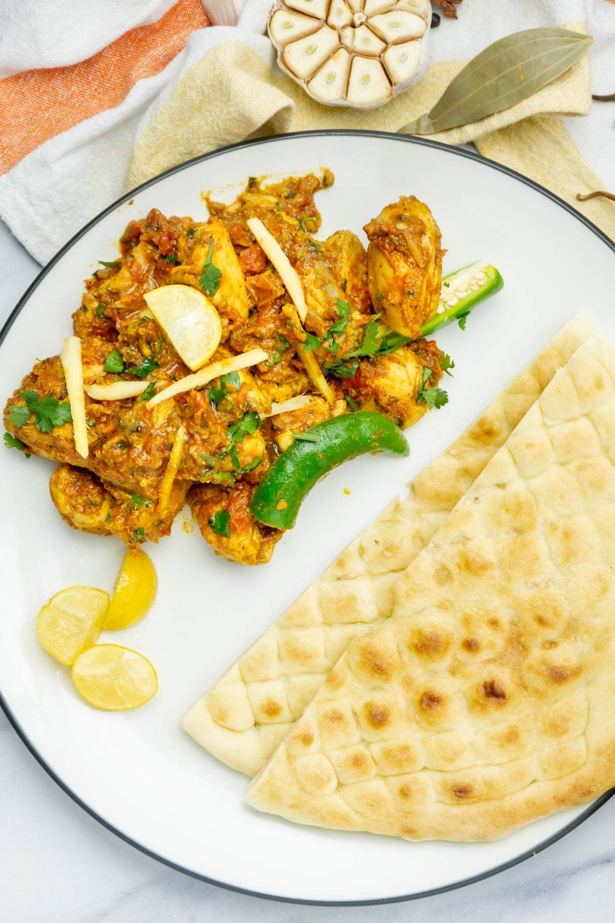 Chicken Karahi with naan in a plate